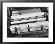 20 Ft. Roll Of Finished Paper Arriving On The Rewinder, Ready To Be Cut And Shipped From Paper Mill by Margaret Bourke-White Limited Edition Pricing Art Print