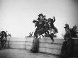 Four Young Girls Jumping Off A Waist High Wall As Two Women Look On At Ft. Greene by Wallace G. Levison Limited Edition Print