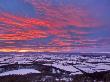 Fiery Sunset Over A Snow Covered Gormire Lake From Sutton Bank On The Edge Of The North Yorkshire M by Lizzie Shepherd Limited Edition Pricing Art Print