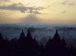 The Temple Of Borobodur At Dawn, Backdrop Of Mist-Shrouded Volcanoes, Borobodur, Unesco World Herit by Lizzie Shepherd Limited Edition Pricing Art Print