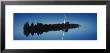 Reflection Of A Wind Turbine And Trees On Water, Black Forest, Germany by Panoramic Images Limited Edition Print