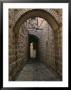 Arch Of Jerusalem Stone And Narrow Lane, Israel by Jerry Ginsberg Limited Edition Print