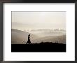 Silhouette Of Woman Walking In Morning Mist, Kengtung, Myanmar (Burma) by Frank Carter Limited Edition Print