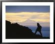 Silhouette Of Hiker Ascending Flat Top Mountain At Sunset by Michael Melford Limited Edition Pricing Art Print