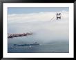 A Blanket Of Fog Covers Part Of Californias Golden Gate Bridge As A Tanker Passes Underneath by James L. Stanfield Limited Edition Print
