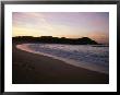 Sunset Reflecting On Beach With Surf Rolling In by Todd Gipstein Limited Edition Print
