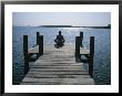 A Woman In A Yoga Pose At The End Of A Dock by Taylor S. Kennedy Limited Edition Pricing Art Print