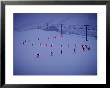 Skiers In An S Formation Make Their Way Down A Gentle Slope At Twilight by Paul Chesley Limited Edition Print