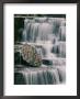 A Time Exposure Captures The Waters Motion As It Falls Over Sculpted Rocks by Skip Brown Limited Edition Print