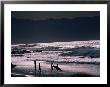 Surfers At Sunset, Ehukai, Oahu, Hawaii by Bill Romerhaus Limited Edition Print