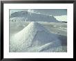 Piles Of Salt Harvested From The Sea Resemble Snow Drifts by Bill Curtsinger Limited Edition Print