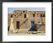 Bright Sunshine Casts Harsh Shadows On This Southwestern Adobe Pueblo Structure by Stacy Gold Limited Edition Print