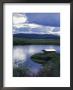 Tangle Lakes Landscape With Cabin And Storm Clouds On Denali Highway, Alaska by Rich Reid Limited Edition Print