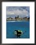 Woman Scuba Diving, Bonaire, Caribbean by Amos Nachoum Limited Edition Print