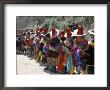 Line Of People Wearing Tibetan Traditional Dress, Tongren, Qinghai Province, China by Occidor Ltd Limited Edition Print