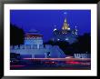 Illuminated Golden Mount At Wat Saket And Democracy Monument Bangkok, Thailand by Tom Cockrem Limited Edition Print