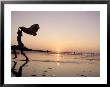 Silhouetted Girl Runs With Beach Towel, Ma by Kindra Clineff Limited Edition Print