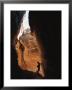 A Man Explores A Cave In Chelser Canyon by Rich Reid Limited Edition Print