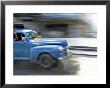 Panned Shot Of Old American Car Splashing Through Puddle On Prado, Havana, Cuba, West Indies by Lee Frost Limited Edition Print