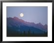 The Full Moon Over Mountains Lit By Low Sunlight by Raymond Gehman Limited Edition Print
