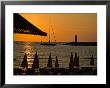 Sunset On Sailboat, Lighthouse And Umbrellas, Kusadasi, Turkey by Joe Restuccia Iii Limited Edition Print