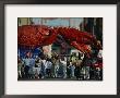Louisianans Revel Beneath A Giant Crayfish Mardi Gras Float, New Orleans by Joel Sartore Limited Edition Print