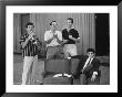 Pat Boone And Bobby Darin Laughing As Paul Anka Sits Brooding And Frankie Avalon Plays The Trumpet by Peter Stackpole Limited Edition Print