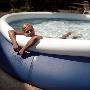 A Young Woman Relaxing In An Inflatable Swimming Pool by Jewgeni Roppel Limited Edition Print