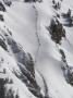 Line Of Skiers Hikes To Reach Slopes Above The Lifts At Jackson Hole by Tim Laman Limited Edition Print