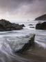 Incoming Tide Swirling Around Rocks On Tregardock Beach, North Cornwall, England, United Kingdom by Adam Burton Limited Edition Print