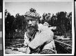 A Bearded Man Wearing A Scottish Tam And Rough Tweed Jacket While Sitting In A Row Boat by George B. Brainerd Limited Edition Print