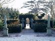 Gwent Garden - A Theatre Flanked By Two Obelisks, In Back Garden Is A Cedar Tree by Clive Nichols Limited Edition Print
