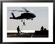 Personnel Fast-Rope Out Of An Sh-60F Seahawk Helicopter by Stocktrek Images Limited Edition Print