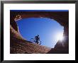 Mountain Biker Stands Under An Arch by Bill Hatcher Limited Edition Pricing Art Print