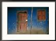 Faded Blue And Red Paint Cover The Entrance To A Dwelling In Addis Ababa by Jodi Cobb Limited Edition Print
