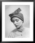 Model Posing In A Bonnet Styled Hat With Streamers That Are Drawn Around The Back Of The Head by Nina Leen Limited Edition Print