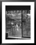 Suburban Housewife Hanging Out A Bit Of Laundry, Seen Through Window In Typical California Home by Loomis Dean Limited Edition Print