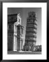 Famed Leaning Tower Of Pisa Standing Next To The Baptistry Of The Cathedral by Margaret Bourke-White Limited Edition Print