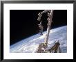 Nchored To The International Space Station's Canadarm2 Foot Restraint by Stocktrek Images Limited Edition Pricing Art Print