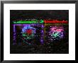 Abstracted Colors Reflect From Restaurant Lights On A Slushy Street by Stephen St. John Limited Edition Print