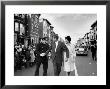 Sen. Jack Kennedy With Jackie, Walking Down Middle Of The Street During Senate Re-Election Campaign by Carl Mydans Limited Edition Pricing Art Print