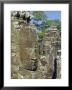 Myriad Stone Heads Typifying Cambodia In The Bayon Temple, Angkor, Siem Reap, Cambodia by Gavin Hellier Limited Edition Print