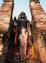 Offerings At Feet Of Buddha Statue, Sukhothai Historical Park, Thailand by Chris Mellor Limited Edition Print