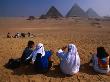 Tourists And Guides Sitting In Front Pyramids, Giza, Egypt by Mason Florence Limited Edition Print