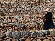 Local Walking Past Rows Of Stone Walls, Ibiza, Spain by Bill Wassman Limited Edition Print