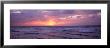Cayman Islands, Grand Cayman, 7 Mile Beach, Caribbean Sea, Sunset Over Waves by Panoramic Images Limited Edition Print