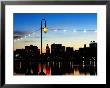 Lake Merritt With Lights At Sunset With City In Background, Oakland, California by John Elk Iii Limited Edition Print