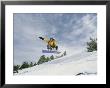 Woman Snowboarding On The Cinder Cone Near Sunset Crater by Kate Thompson Limited Edition Print