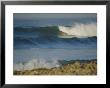 Large Waves Break And Rush To A Rocky Shore At Sunrise by Rich Reid Limited Edition Pricing Art Print