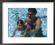 Father Teaches His Child How To Swim, Chevy Chase, Maryland by Stacy Gold Limited Edition Print